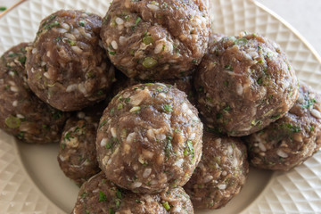 Meat meatballs on a plate. Meat meatballs on a white plate. Meat balls on a white background