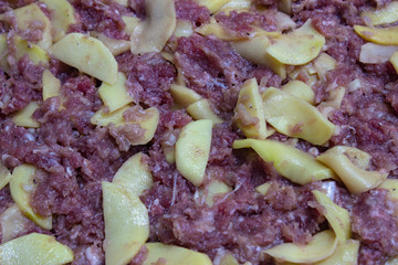 Meat pie before cooking. Minced meat with potatoes. Meat with potatoes. Minced meat with potatoes in the dough