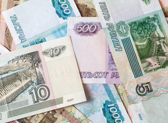 Money. Russian rubles. Notes in denominations of five, ten, one hundred, five hundred and one thousand rubles. Cash.