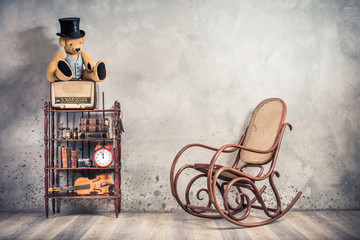 Teddy Bear in cylinder hat on vintage radio, antique books, clock, camera, binoculars, fiddle, keys...