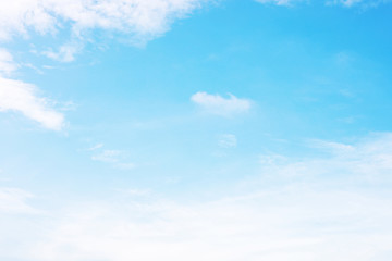 Blue sky background and white clouds soft focus, and copy space