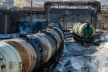 Fototapeta na wymiar Railway trains with tanks for the transport of petroleum products are on the siding