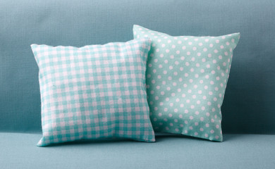Couple of turquoise pillows on the sofa