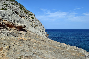Sea bay with turquoise water, beach and mountains, Cala Figuera on Cap Formentor