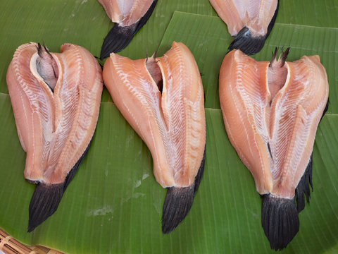 Dried striped snakehead fish or Channa striata on banana leaf. Preservation of striped snakehead fish in asia.