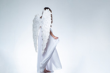 Angel girl. Long white wings. Wonderful blonde angel girl with white wings.