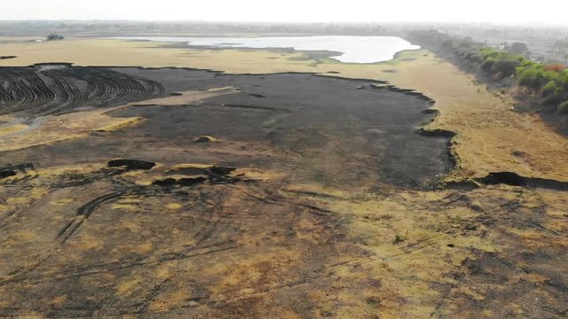 drying up of a lake due to evaporation in summers 
