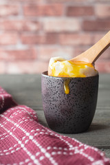 Broken Soft Boiled Egg In A Cup On Rustic Table