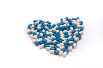 different pills on white background