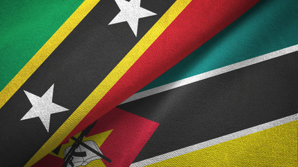 Saint Kitts and Nevis and Mozambique two flags textile cloth, fabric texture