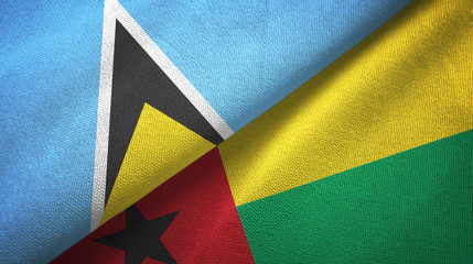 Saint Lucia and Guinea-Bissau two flags textile cloth, fabric texture