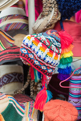 Multiple styles of peruvian hats at a local market in Cusco, Peru.