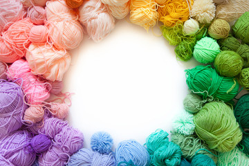 Color wheel of yarn. Rainbow and spectrum. White background. Threads of different colors.