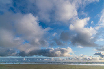 White Clouds and Blue Skies Along Ocean
