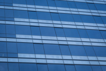 Fototapeta premium Glass windows of modern office building