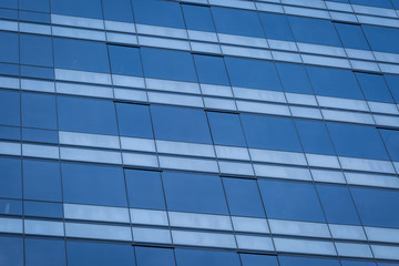 Fototapeta na wymiar Glass windows of modern office building