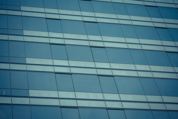 Obraz na płótnie Canvas Glass windows of modern office building