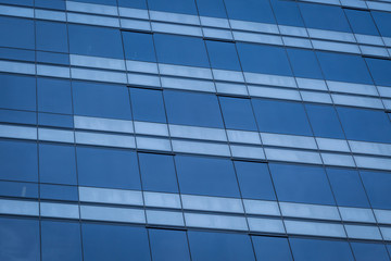 Obraz na płótnie Canvas Glass windows of modern office building