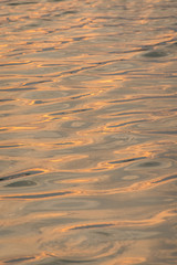beautiful water wave pattern sunset with nice harmonic structure and reflections