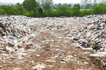 garbage dump pile in trash dump or landfill,truck is dumping the gabage from municipal,pollution concept.