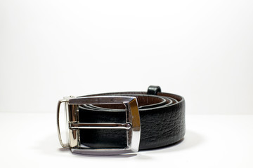 Isolated leather belt in rolling on white background