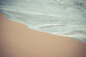 Soft foam wave and sea on the sandy beach