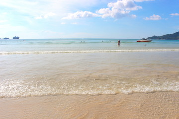 Phuket Province, Thailand - November17, 2017: Nai Harn Beach. Beautiful beach and sea in Phuket, Thailand.   Traveller from around the world come to relax in the summer holidays.