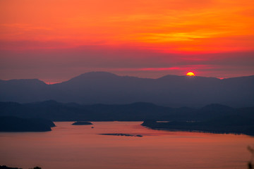 The natural background of the beautiful twilight sky, the surrounding atmosphere (trees, rivers, mountains) is a beautiful view of the journey, the view point. 