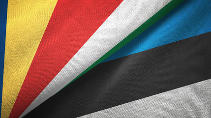 Fototapeta na wymiar Seychelles and Estonia two flags textile cloth, fabric texture