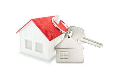 key chain with house symbol and keys on white background,Real estate concept