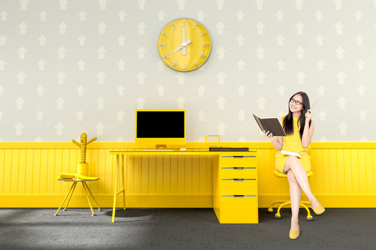 business woman sitting at the desk yellow color