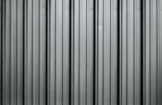 Monochromatic corrugated metal sheet texture background
