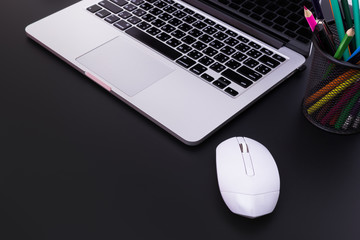 flat lay Office desk table of modern workplace with laptop on black table, top view laptop background and copy space on black background, White desk office with laptop, 