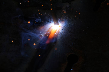 Fototapeta na wymiar Metal welding by an electrode.
