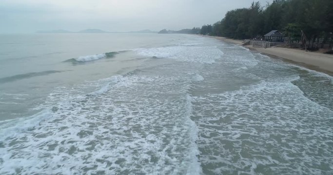 Drone flying over the sea during the morning mist at Mae Pim beach Rayong Thailand