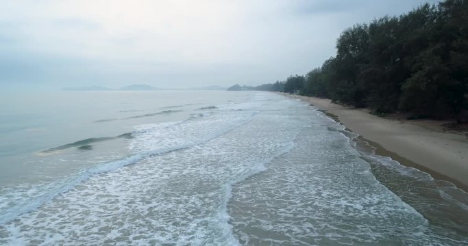 Drone flying over the sea during the morning mist at Mae Pim beach Rayong Thailand