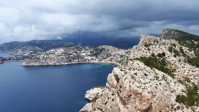 Orbiting a mountain in the bay. 
Image is 4k with 30 fps. Location is Spain - Majorca