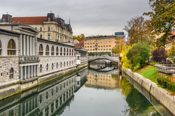 Fototapeta na wymiar View of Ljubljanica river and Triple Bridge or Tromostovje. Ljubljana. Slovenia