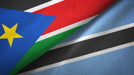 South Sudan and Botswana two flags textile cloth, fabric texture 