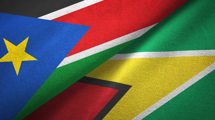 Fototapeta premium South Sudan and Guyana two flags textile cloth, fabric texture