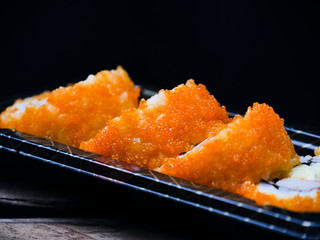 Sushi maki california roll are mood tone color orange. repeat pattern japanese food