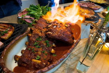 Pork Rib on Fire from chef which delicious taste good look, Smoked steak Ham Pork in American Style BBQ grill on natural charcoal to make good smell