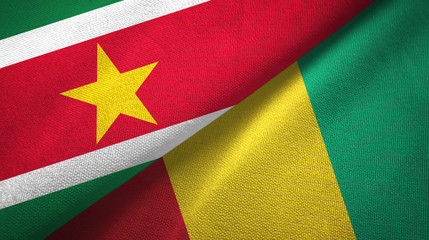 Fototapeta premium Suriname and Guinea two flags textile cloth, fabric texture