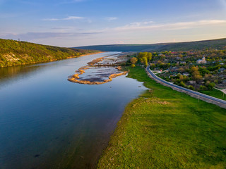 Arial view over the river and small village.