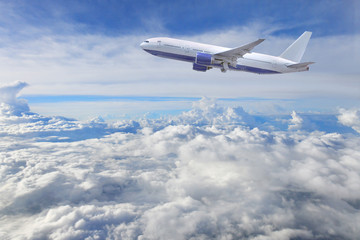Naklejka na ściany i meble Large passenger plane flying ,With blue and cloudy sky.