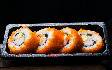 Sushi maki california roll are mood tone color orange. repeat pattern japanese food