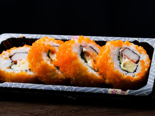 Sushi maki california roll are mood tone color orange. repeat pattern japanese food