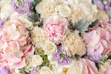 Large Beautiful bouquet of mixed flowers in woman hand. Floral shop concept . Beautiful fresh cut bouquet. Flowers delivery