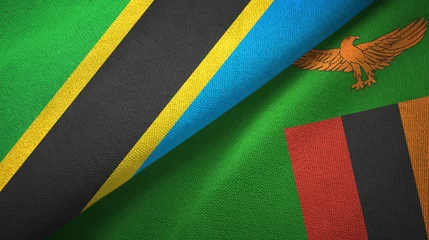 Foto op Aluminium Tanzania and Zambia two flags textile cloth, fabric texture © Oleksii