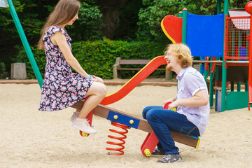 Fototapeta na wymiar Happy couple on playground